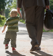 Professional man walking his child to school or daycare